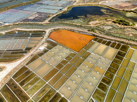 Aerial drone view of Gu&eacute;rande salt marshes and evaporation pans in Brittany, France
