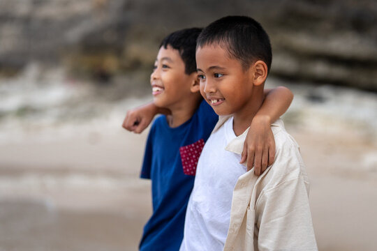 Close-up of loving brothers sharing a strong bond and togetherness outdoors on summer vacation