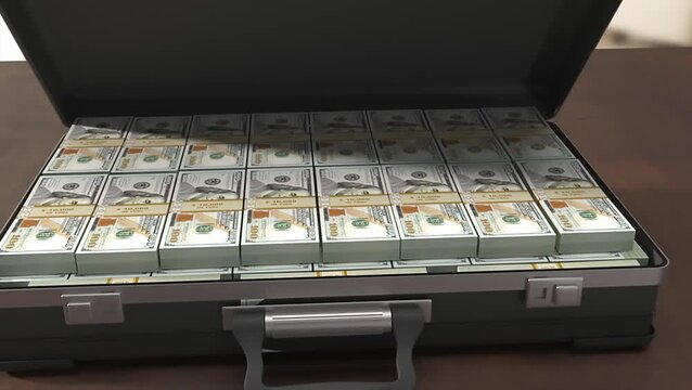 An open briefcase filled with stacks of one hundred dollar bills on a wooden table.