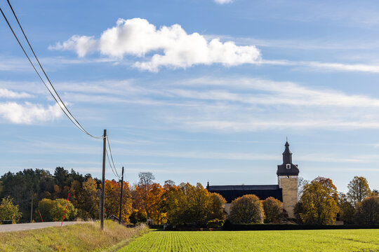 Nykoping, Sweden An autumn view of the Holo Kyrka, or Holo Church with foliage.