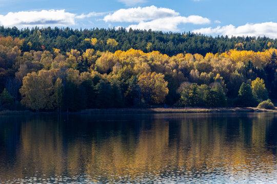 Nykoping, Sweden An autumn foliage landscape and reflections over an inlet in the Baltic Sea.