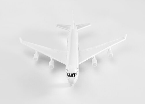 White toy airplane model front view isolated on white background