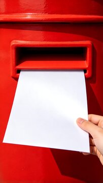 Red Mailbox with Hand Sending a White Letter