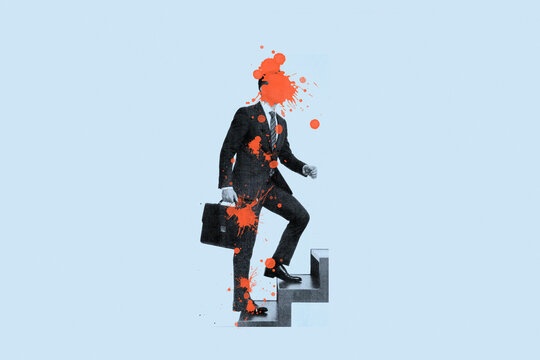 Businessman with paint splash on face walking up stairs carrying briefcase