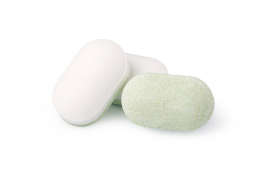 White and green oblong tablets for medication and healthcare