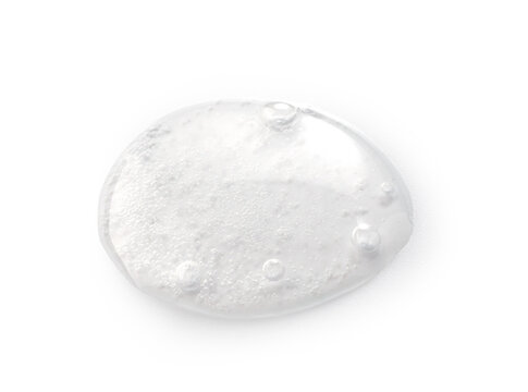 Transparent skincare gel smear with air bubbles on white background