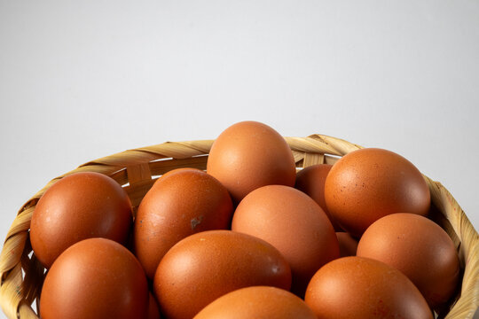 Brown Eggs in Woven Basket with Copy Space