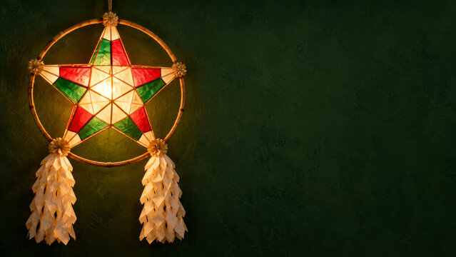 Merry Christmas Filipino parol lantern with bamboo frame, red and green paper star and folded tails on dark green background, warm cultural greeting scene with copy space for holiday event banners