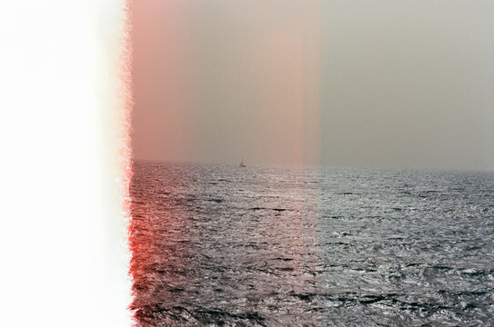 Lone sailboat on the sea near Tenerife, Spain, on film