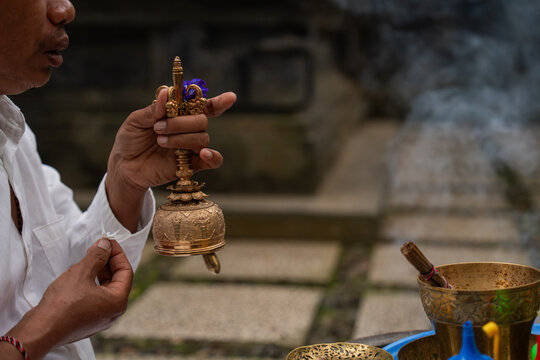 Bell Ringing During a Ceremony at a Temple