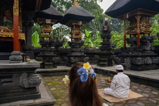 Ceremony at a Temple in Bali With People and Offerings
