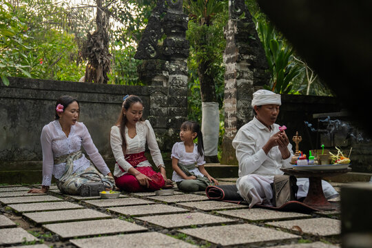 People Gather at a Balinese Temple for a Traditional Ceremony