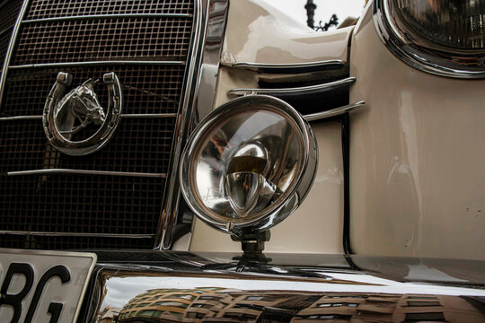 GANDIA, SPAIN - OCTOBER 4, 2026: Front detail of a vintage 1960 Mercedes Benz 190 D Ponton classic car showing the chrome radiator grille, emblem, fog light, and bumper.