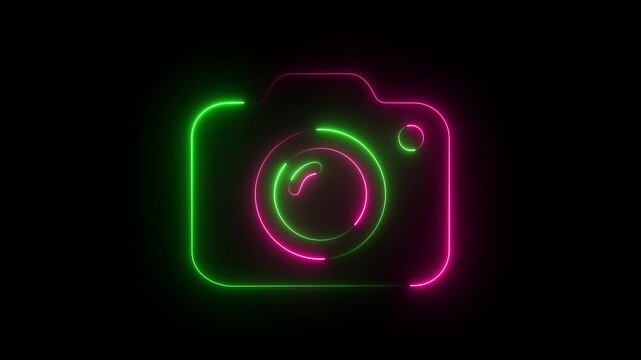 Pink and green neon camera icon on dark background, glowing photography photo lens symbol.