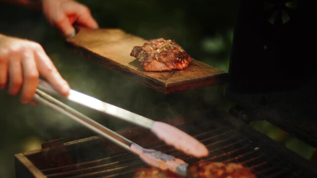 Cooking delicious meat on outdoor grill during daytime in summer