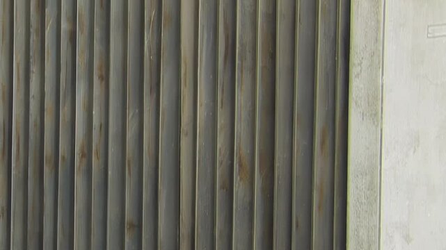 Industrial Metal Fins With Pipe and Fastener Detail. Close industrial footage emphasizes repeating metal fins, grids, pipes and structural frame details without claiming a specific function.