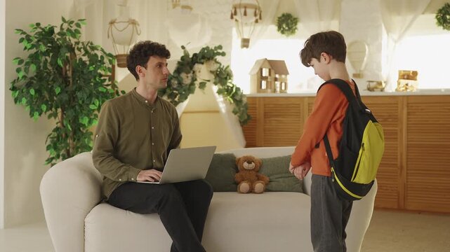 Upset schoolboy talks to dad about school bullying problem, parental support