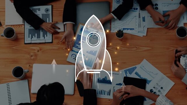 This image showcases a business strategy concept with a rocket icon overlaid, highlighting teamwork and innovation amidst charts and graphs on a professional desk. Raster