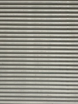Gray corrugated rolling steel shutter texture