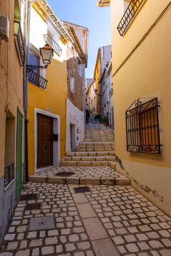 A picturesque corner of the historic centre of Biar, Alicante, Spain, with its colourful fa&ccedil;ades
