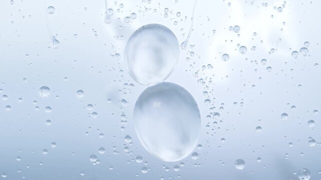 Merging top-right beads forming runner while two large drops sliding on glass by gravity cloudy sky