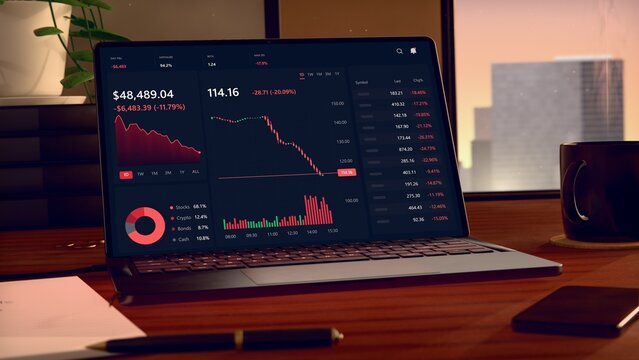 Flat-design laptop is displaying dark finance dashboard on wooden desk, declining charts