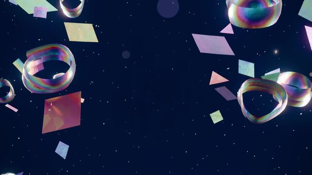 Playback starting, CGI cluster drifting inward in navy void with shiny rings soft tiles as confetti