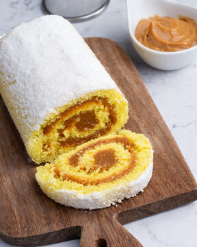 Roll cake or swiss cake filled with dulce de leche
