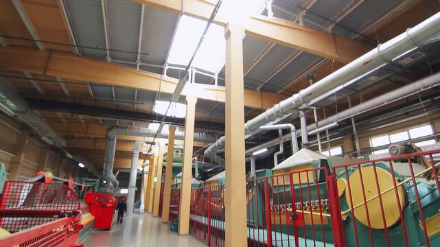 Factory workshop tilt up ceiling skylight. Machinery safety railing handheld.