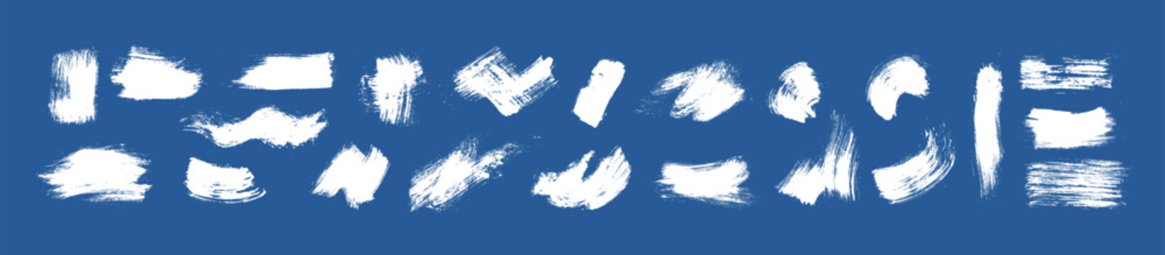 Collection of white dry brush strokes on a blue background. Broad paint swashes, curved marks and narrow streaks show bristle detail, rough edges and varied textures.