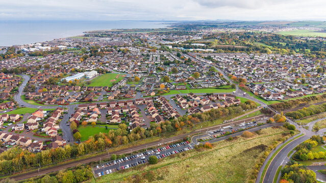 Panoramic aerial view of Musselburgh town with railway station and Firth of Forth coastline in East Lothian