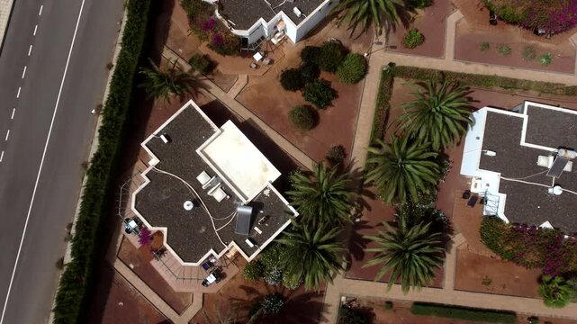 An aerial view of a residential area with houses roads and landscaping