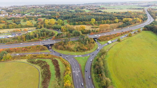 Elevated view of Old Craighall roundabout junction with A1 bypass stretching towards the coast in East Lothian