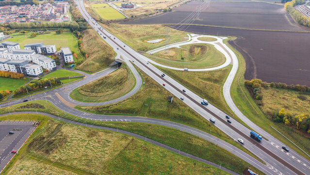 Drone view of traffic flow passing Queen Margaret junction on A1 dual carriageway in East Lothian