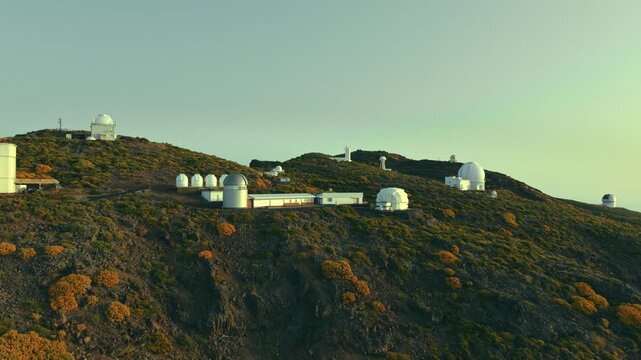 Drone flight past astronomical observatory domes at Roque de los Muchachos, La Palma, Spain