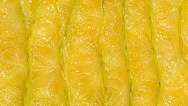 Golden starfruit flesh texture with long pale green ridges