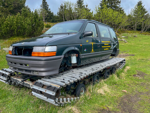 Swieradow-Zdroj, Poland, May 15, 2026: A snow-grooming vehicle (piste machine) waiting for the winter season