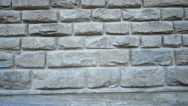 Stone block wall texture showing sharp detailed masonry and rugged stone surface for building background; background backplate template calm.