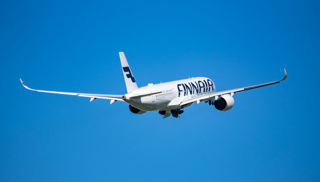 Finnair Airbus A350-900 OH-LWR climbing from Amsterdam Schiphol Airport to Helsinki with landing gear retracting on October 4, 2024.