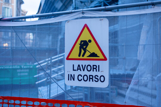 Italian roadworks warning sign Lavori in corso on construction site netting in Rome, Italy