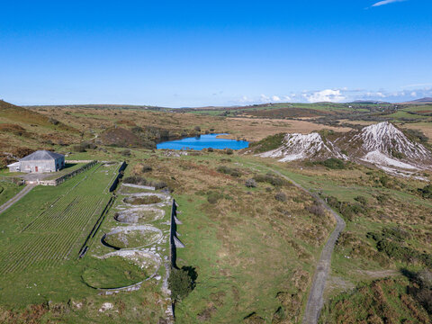 Aerial view of industrial heritage site including pan kiln and slag heaps at Glynn Valley, Cornwall