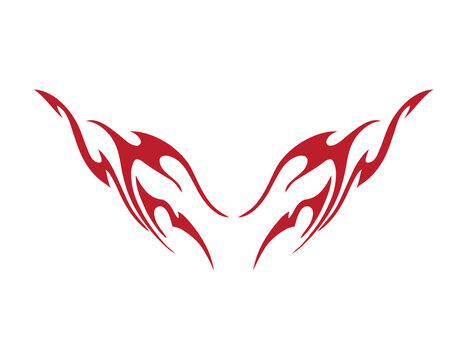 Red tribal flame wings with symmetrical pointed flourishes isolated on white background. Abstract tattoo style fire decal pair for motorcycle and car design. Gothic ornamental graphic element.