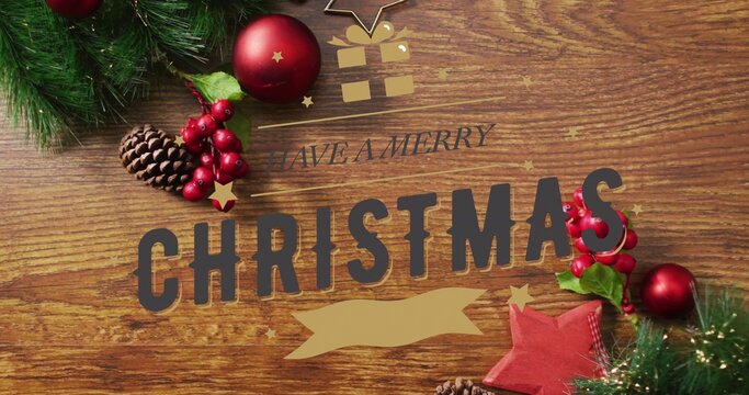 Featuring centered CHRISTMAS block letters on wood table, showing HAVE MERRY gold ribbon, pinecones