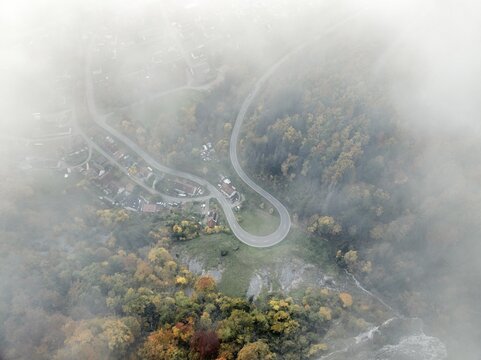 Aerial view of the viewpoint, shovels and Hausen Castle, also known as the Hausen ruins, surrounded by autumnal vegetation and clouds of fog on the village of Hausen in the valley in the Upper Danube Valley, Beuron, Sigmaringen district, Baden-W&uuml;rttemberg, Germany