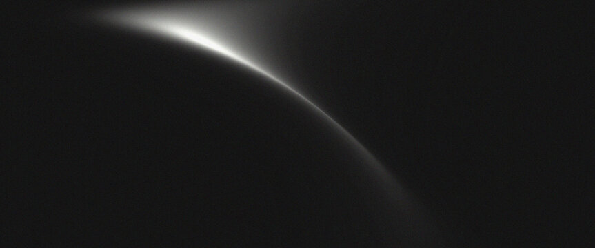 Abstract black background with glowing white curved light arc resembling planet horizon and fine grainy texture