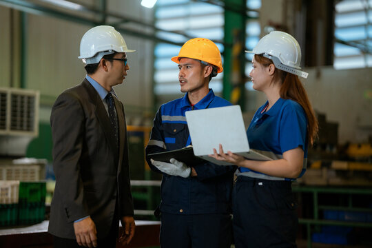 The foreman is checking on operations and holding meetings with his diverse team members in the steel factory.
