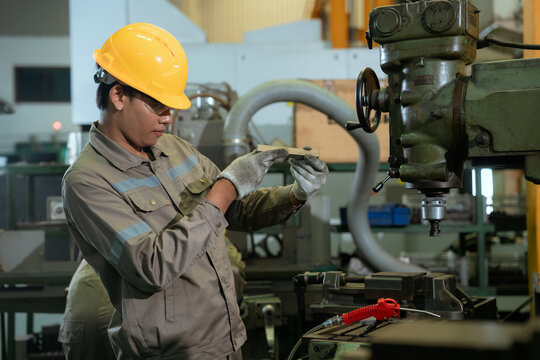 Technical engineer workers working in control room plant at industry factory to service maintenance on engineering machine, production technician occupation in global industrial business concept