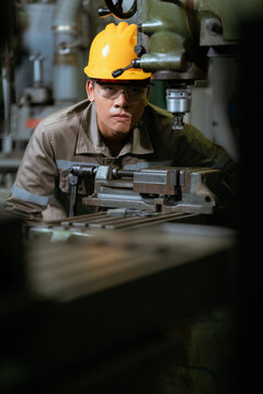 Technical engineer workers working in control room plant at industry factory to service maintenance on engineering machine, production technician occupation in global industrial business concept