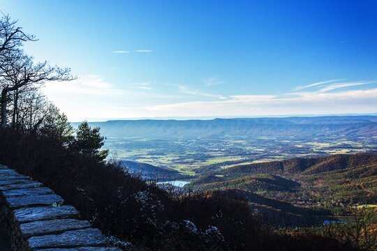 Layered blue mountain ridges under a clear sky