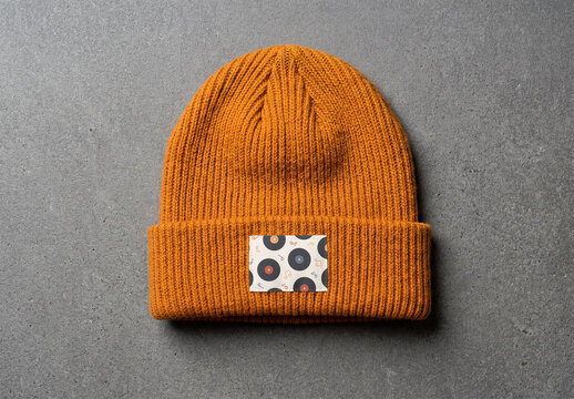 Mockup Template of Woven Patch Label on Orange Beanie